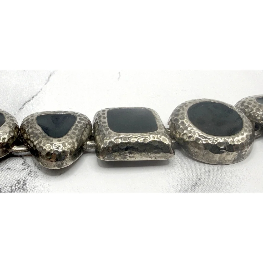 Source Unknown bold silver